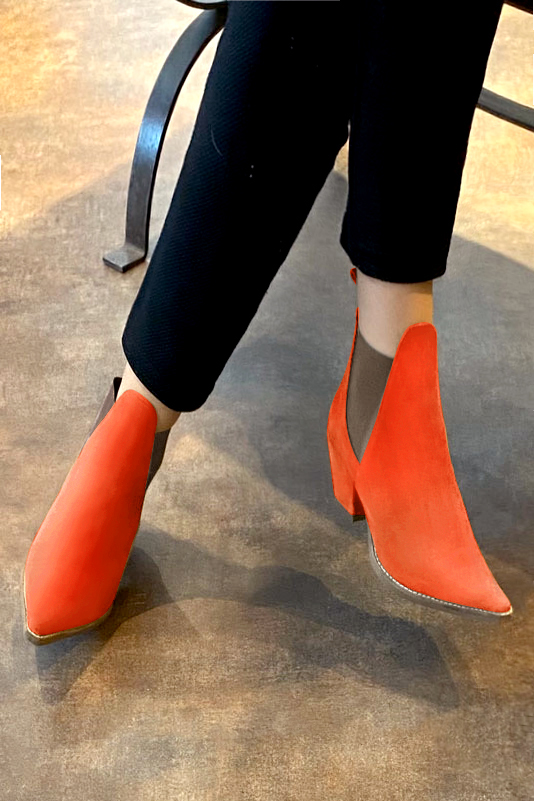 Clementine orange and taupe brown women's ankle boots, with elastics. Pointed toe. Medium cone heels. Worn view - Florence KOOIJMAN